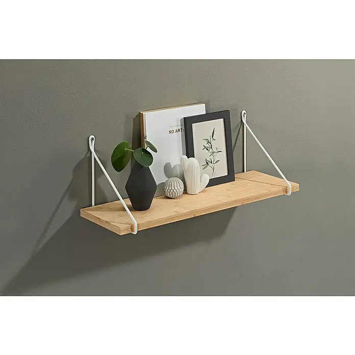 Dolle Wandboard Lite Vintage - L x B x S: 60 x 15 x 2 cm, Eiche - Ein schwebendes Holzregal mit weißen Metallhalterungen, dekoriert mit einer Pflanze, einem Buch, einem Rahmen und dekorativen Objekten.