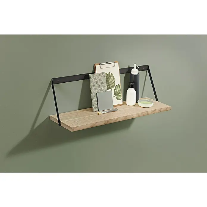 Dolle Wandboard Lite Vintage - L x B x S: 80 x 15 x 2 cm, Eiche - Ein Wandregal mit einer hellen Holzoberfläche und schwarzen Metallhalterungen, auf dem Bücher, Kunst und Farbflaschen platziert sind.