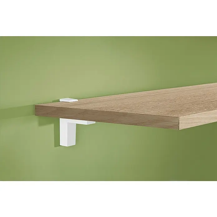 Dolle Wandregalhalter-Set Eliot - Belastbarkeit: 25 kg, Passend für: Regalbodenstärke 6 - 40 mm, Weiß, 2 Stk. - Nahaufnahme eines Regals aus hellem Holz, das an einer grünen Wand mit weißen Halterungen befestigt ist.