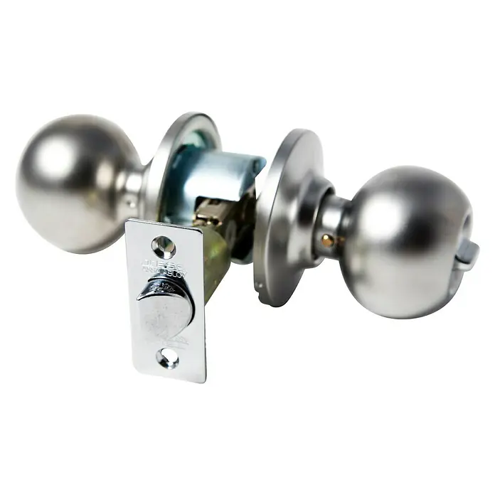Tesa Assa Abloy Pomo giratorio 3900 CM - Acero - Primer plano de un juego de manillas redondas plateadas con mecanismo de bloqueo visible sobre un fondo negro.