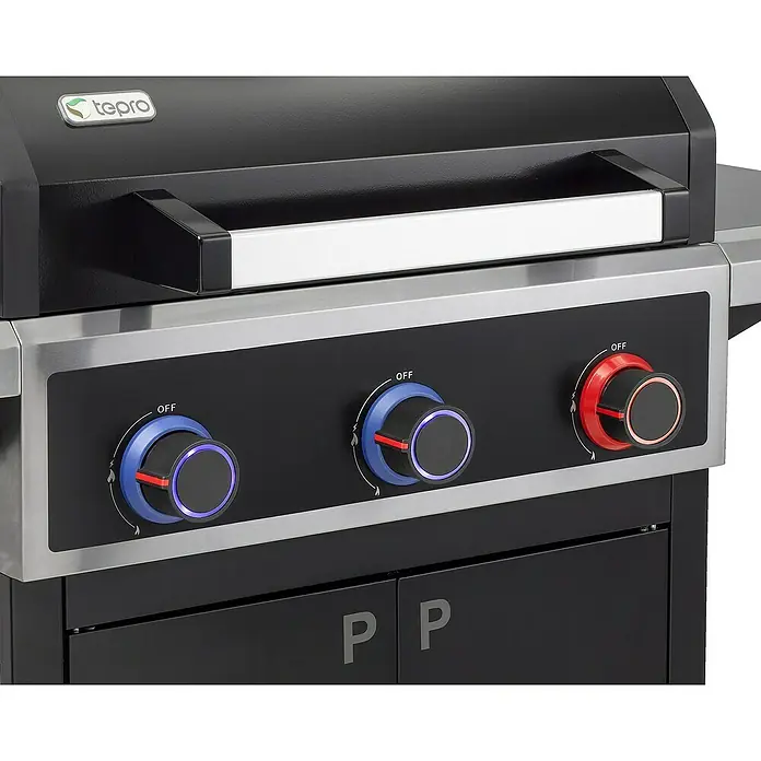 Tepro Gasgrill Keansburg - Grillfläche (B x T): 61 x 43 cm, 10,6 kW, Anzahl Brenner: 3 - Nahaufnahme eines Tepro Gasgrills mit Reglern und silbernen Akzenten, die das moderne Design hervorheben.