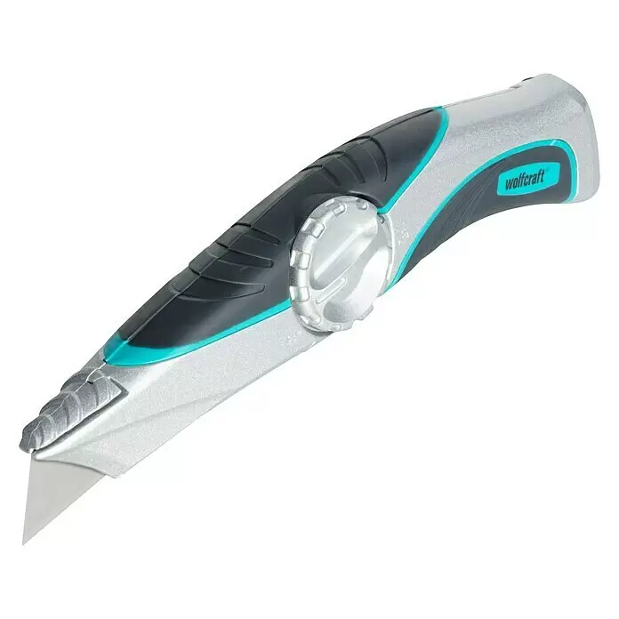 Wolfcraft Navaja de bolsillo - Largo: 52 mm, Metal, Plateado - Cúter Wolfcraft gris y negro con detalles turquesa y un bloqueo de hoja giratorio plateado, con la hoja parcialmente expuesta.
