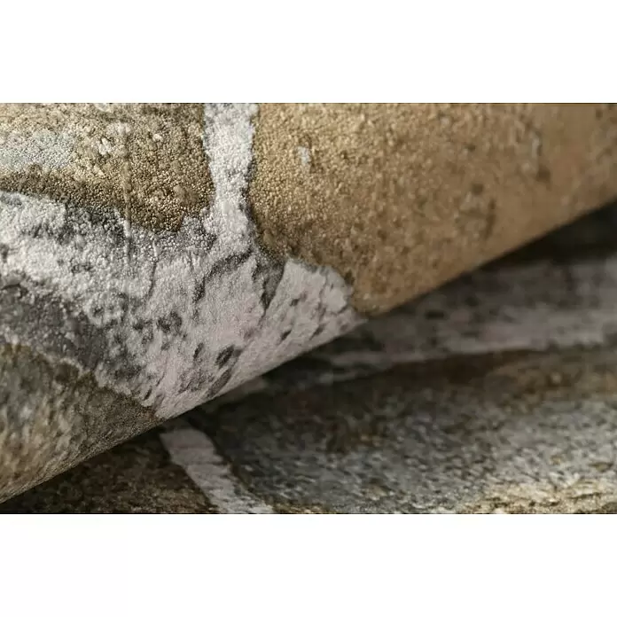 Rasch Factory 4 Vliestapete Steinmauer - Braun, Steinoptik, 10,05 x 0,53 m - Nahaufnahme eines strukturierten Textils mit körniger Oberfläche und abstraktem Muster in Weiß, Grau und Erdtönen.