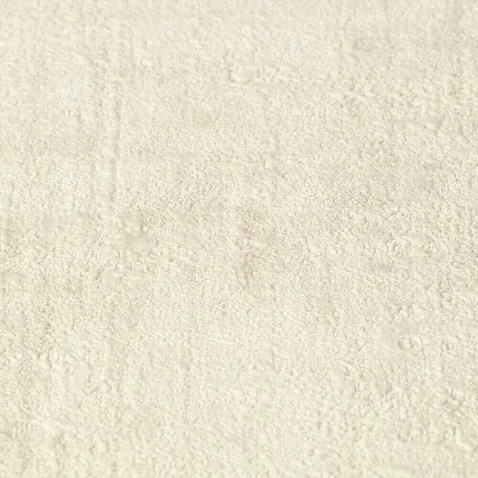 Rasch Factory 4 Vliestapete - Hellbraun, Uni, 10,05 x 0,53 m - Nahaufnahme einer beigen, strukturierten Wand, die eine natürliche und ruhige Atmosphäre erzeugt. Ideal für subtile Akzente.