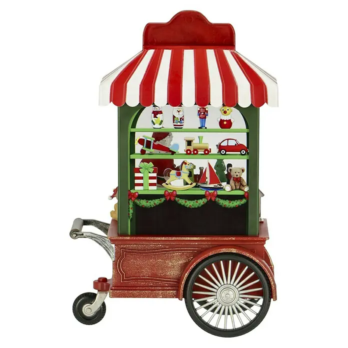 Konstsmide LED-Schneelaterne Santa´s Workshop - Innen, Bunt, 9 x 17,5 x 27 cm, Batteriebetrieben - Weihnachtlicher Spielzeugwagen mit rot-weißem Dach und verschiedenen Spielzeugen auf den Regalen, festliche Dekoration.