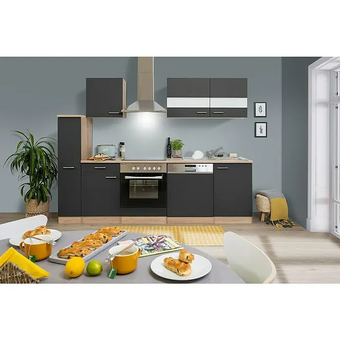 Respekta Singleküche Merle Typ 1 - Breite: 250 cm, Grau, Mit Elektrogeräten, Volumen Backofen: 72 l - Küchenansicht mit modernen, dunkelgrauen Schränken, einer Dunstabzugshaube aus Edelstahl und einer ansprechenden Frühstückstafel.