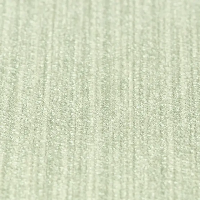 Rasch BARBARA Home Collection II Vliestapete - Pastellgrün, Uni, 10,05 x 0,53 m - Nahaufnahme eines beigen Teppichs, der eine weiche und einladende Textur zeigt, ideal für eine gemütliche Atmosphäre im Wohnraum.