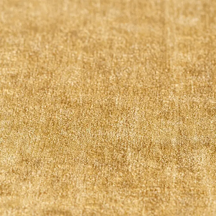 Rasch Factory 4 Vliestapete - Gold, Uni, 10,05 x 0,53 m - Nahaufnahme eines beigen Teppichs, der eine weiche Textur und ein warmes, einladendes Gefühl vermittelt.