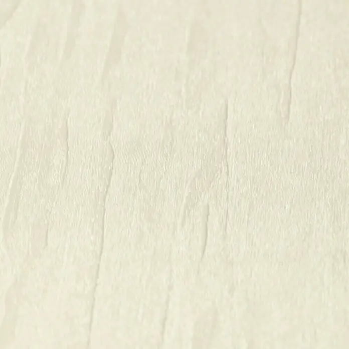 Rasch Selection Vliestapete I - Creme, Uni, 10,05 x 0,53 m - Nahaufnahme einer strukturierten, cremefarbenen Oberfläche. Das subtile Muster erzeugt ein Gefühl von Textur und Tiefe.